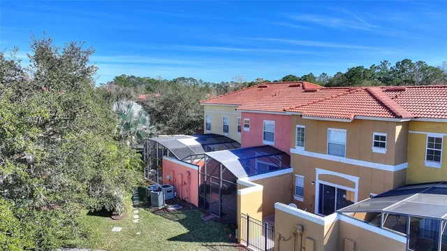 an aerial view of a houses with outdoor space