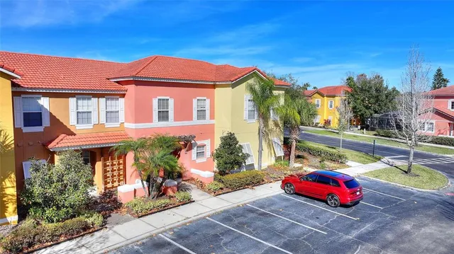 a backyard of a house with outdoor seating
