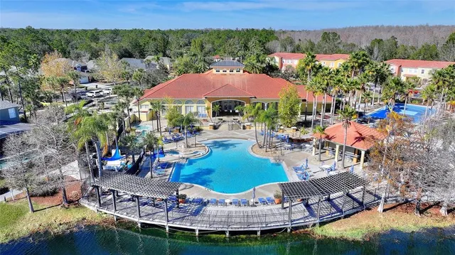 an aerial view of a house with a yard and garden
