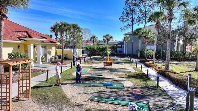 a living room with furniture a window and a clock