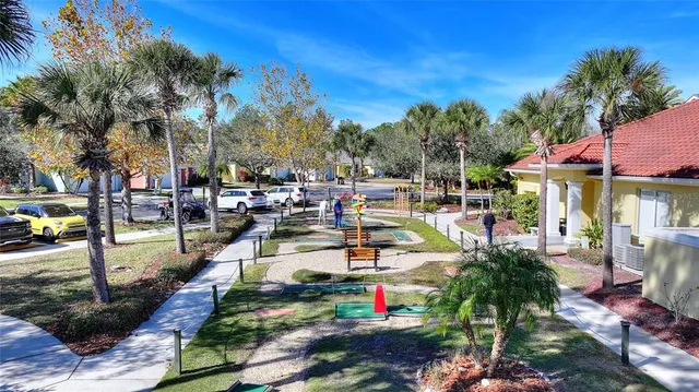 a living room with lots of furniture and baby bed