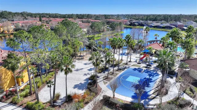 a room with pool table and windows