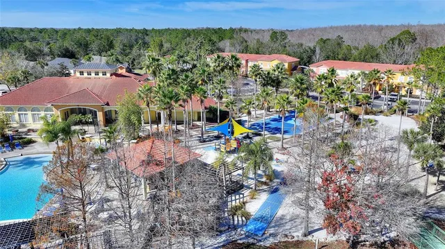 a room with pool table and a chandelier