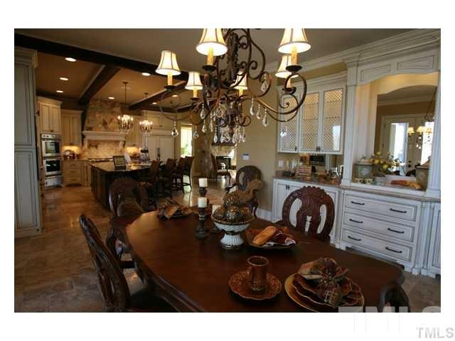 11229 Conley Cove Court Raleigh, NC 27613 - Photo 11 of 22 a kitchen with a table and chairs in it