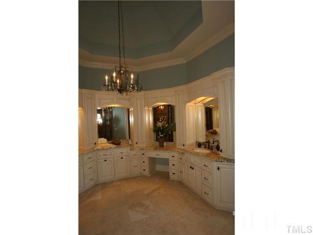 11229 Conley Cove Court Raleigh, NC 27613 - Photo 13 of 22 a bathroom with a double vanity sink and a mirror
