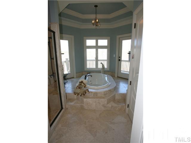 11229 Conley Cove Court Raleigh, NC 27613 - Photo 14 of 22 a bathroom with a sink and a mirror