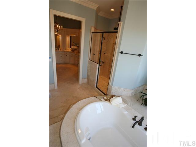 11229 Conley Cove Court Raleigh, NC 27613 - Photo 15 of 22 a bathroom with a sink and mirror