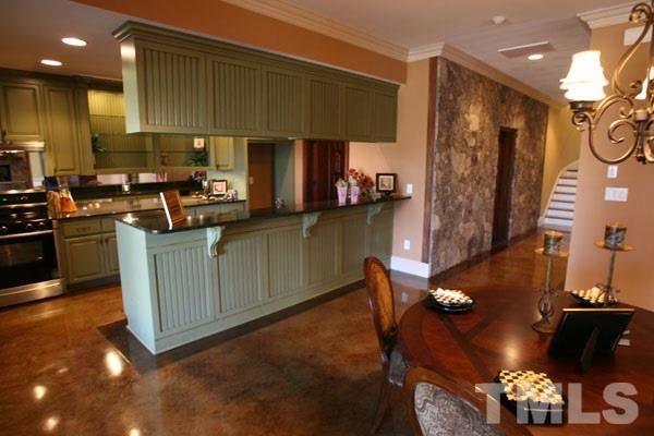 11229 Conley Cove Court Raleigh, NC 27613 - Photo 16 of 22 a kitchen with granite countertop cabinets and black stainless steel appliances