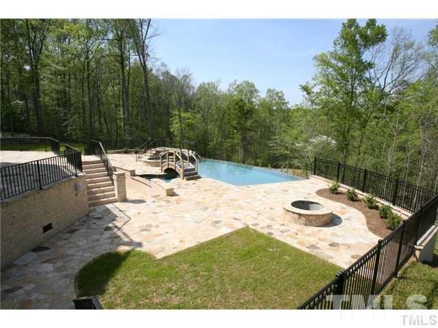 11229 Conley Cove Court Raleigh, NC 27613 - Photo 6 of 22 a view of backyard with swimming pool and outdoor seating
