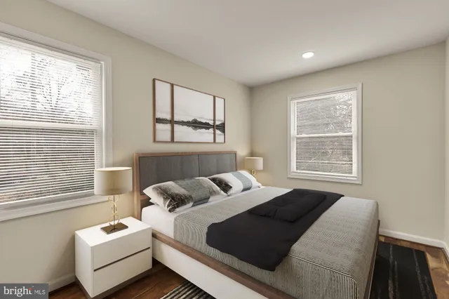 a bedroom with bed and a window