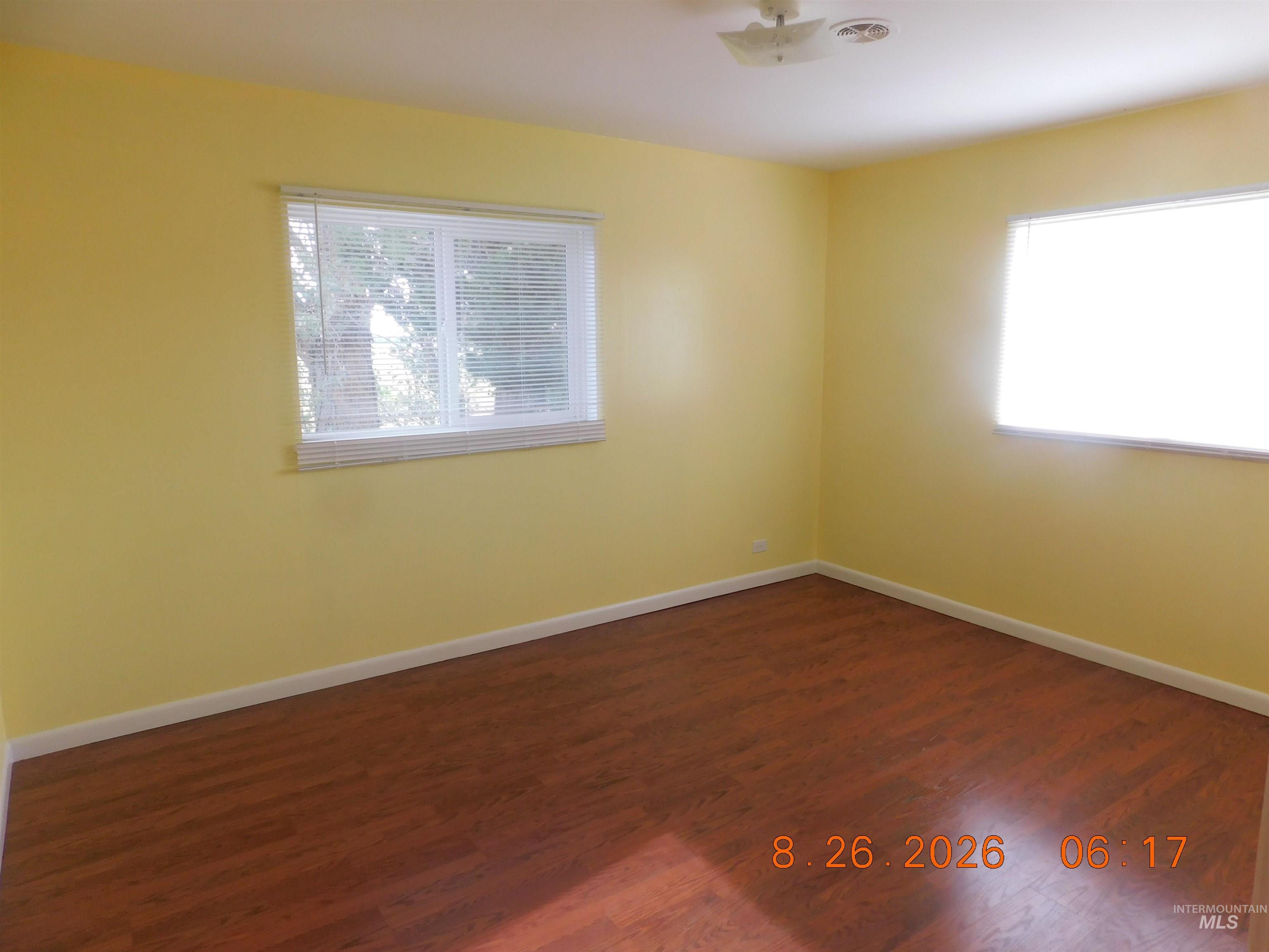 2115 North Galena Road Council, ID 83612 - Photo 14 of 18 Wood-finish flooring, white trim, and light yellow walls
