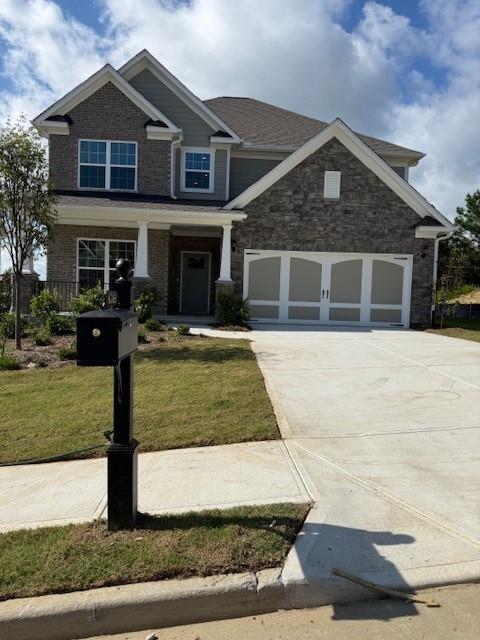 4286 Azalea Ridge Way Hoschton, GA 30548 - Photo 1 of 1 a front view of a house with a yard