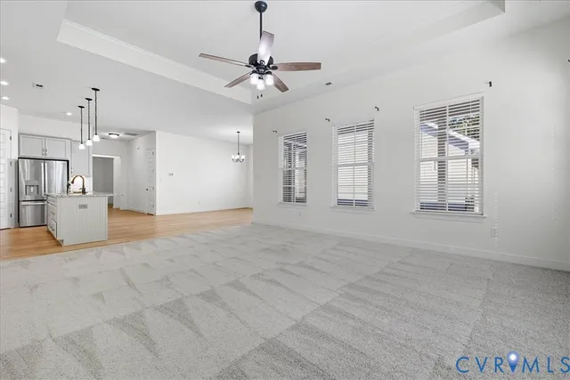 a view of a kitchen with a sink and cabinet area