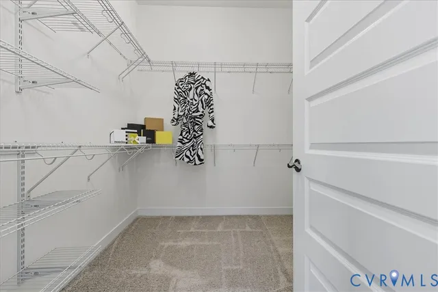 a view of storage and utility room with racks on the wall