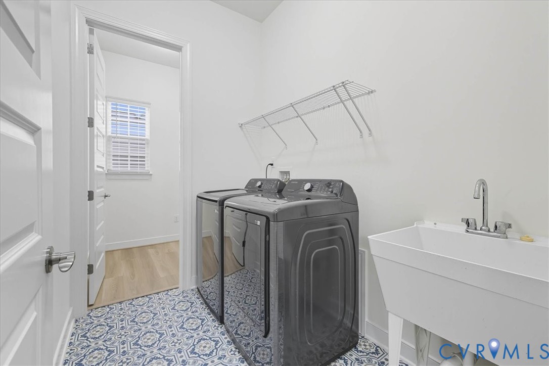 1813 Twin Rivers Court Chester, VA 23836 - Photo 21 of 33 The laundry room offers a utility sink, which is a