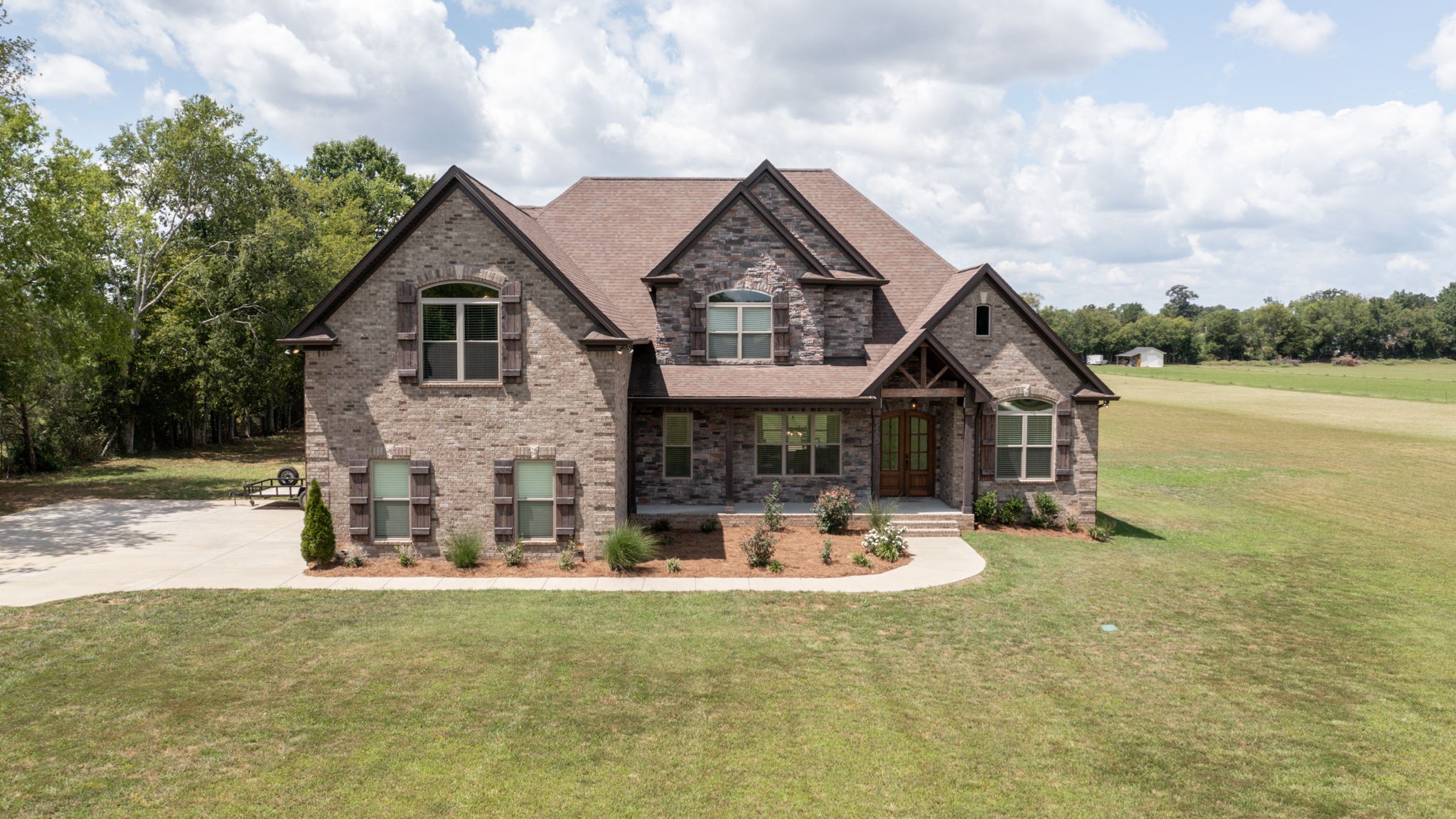 7400 Cedar Forest Road Lebanon, TN 37090 - Photo 1 of 70 a front view of a house with a yard