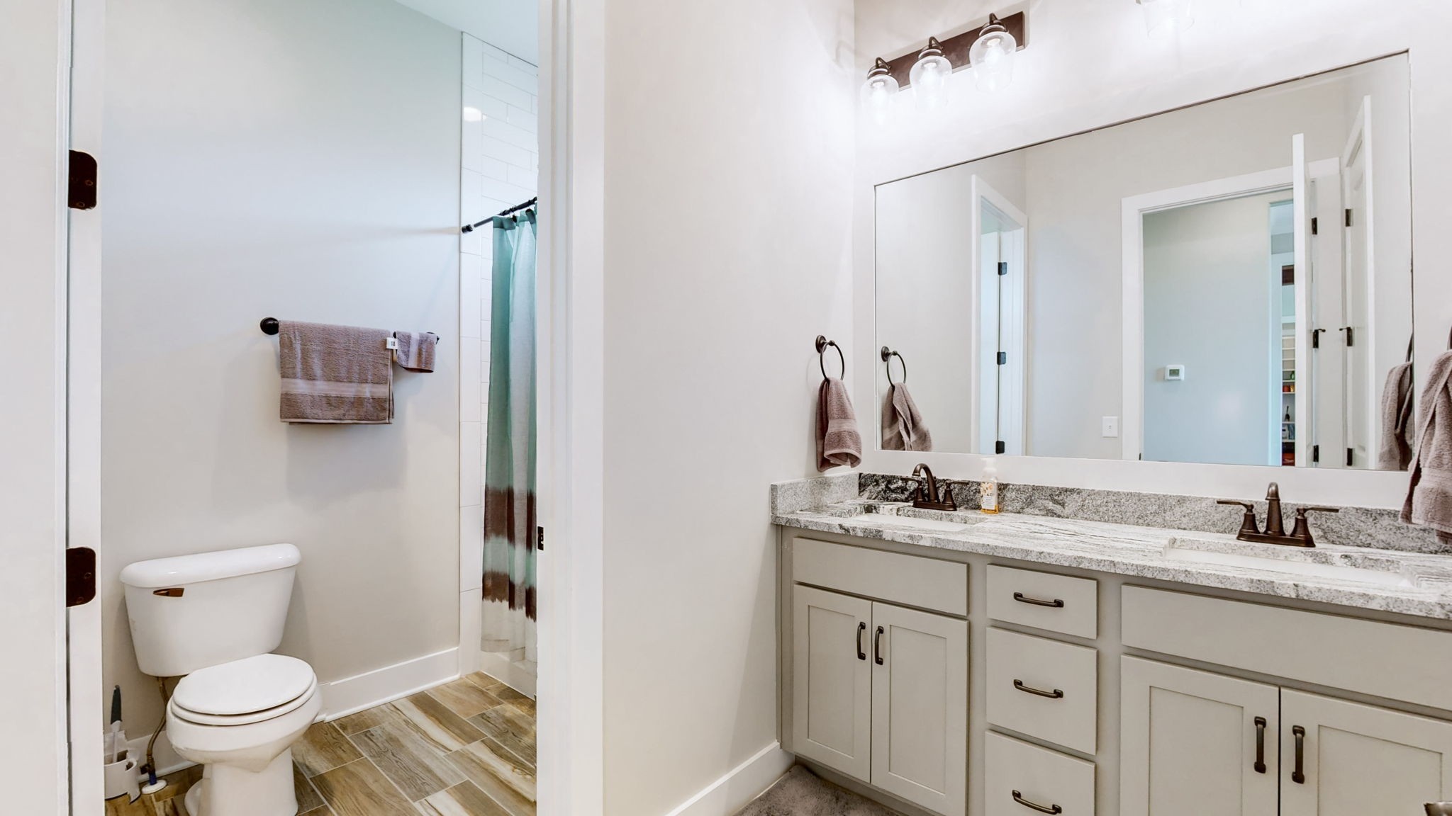 7400 Cedar Forest Road Lebanon, TN 37090 - Photo 45 of 70 a bathroom with a granite countertop sink toilet and mirror