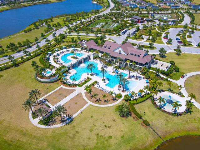 an aerial view of a house with a swimming pool