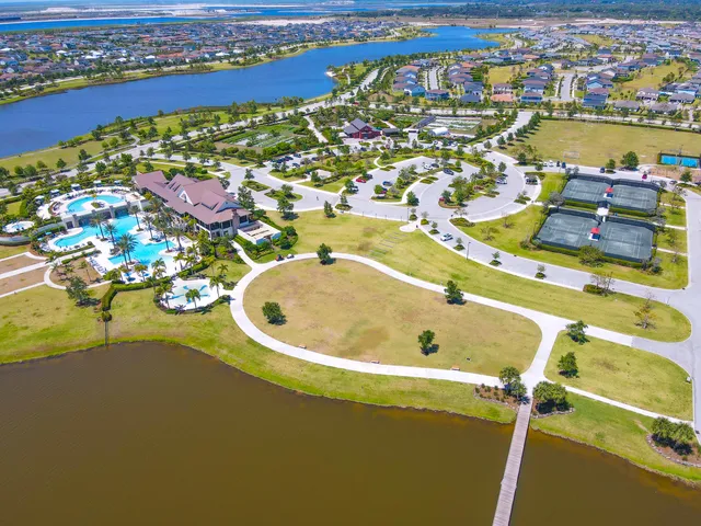 an aerial view of swimming pool a building and outdoor space