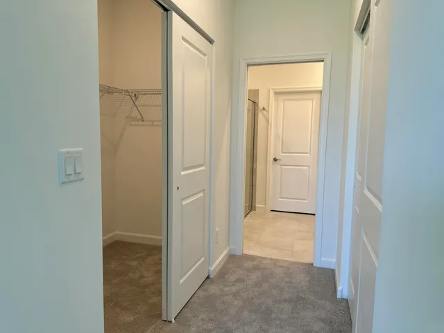 a bathroom with a glass shower door