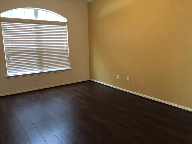 a white toilet sitting next to a sink and a mirror