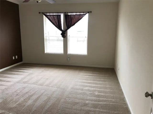 a bathroom with a tub and shower