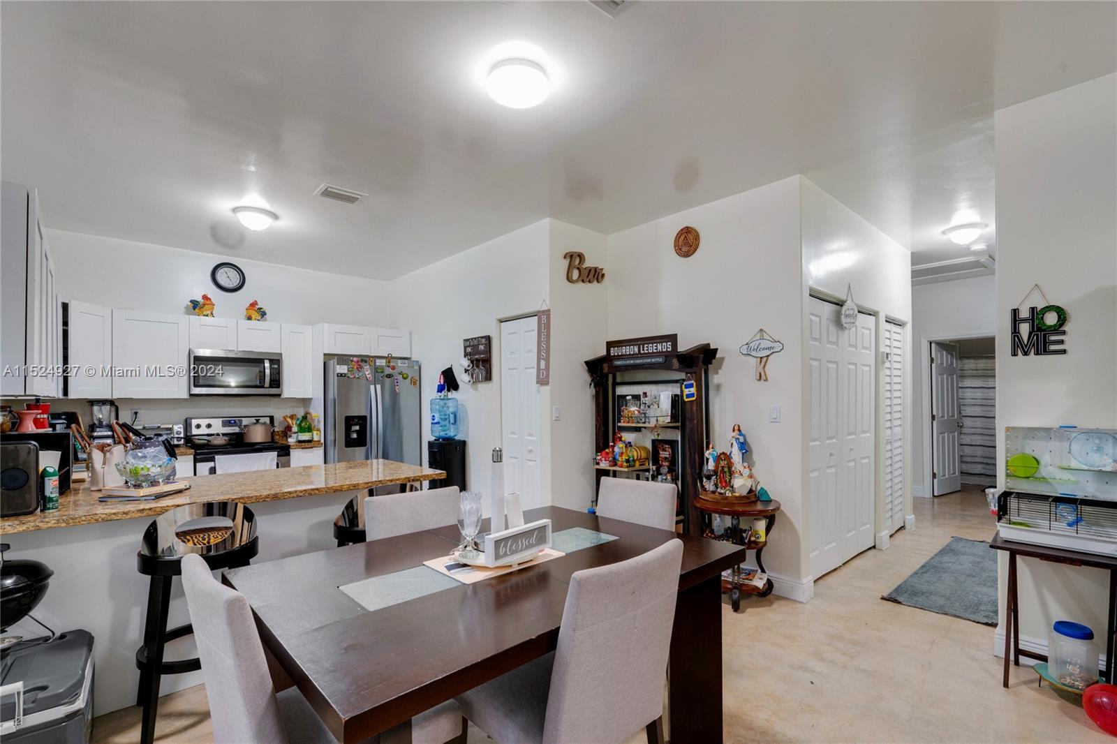 10129 West Jessamine Street Miami, FL 33157 - Photo 14 of 50 a view of a dining room with furniture