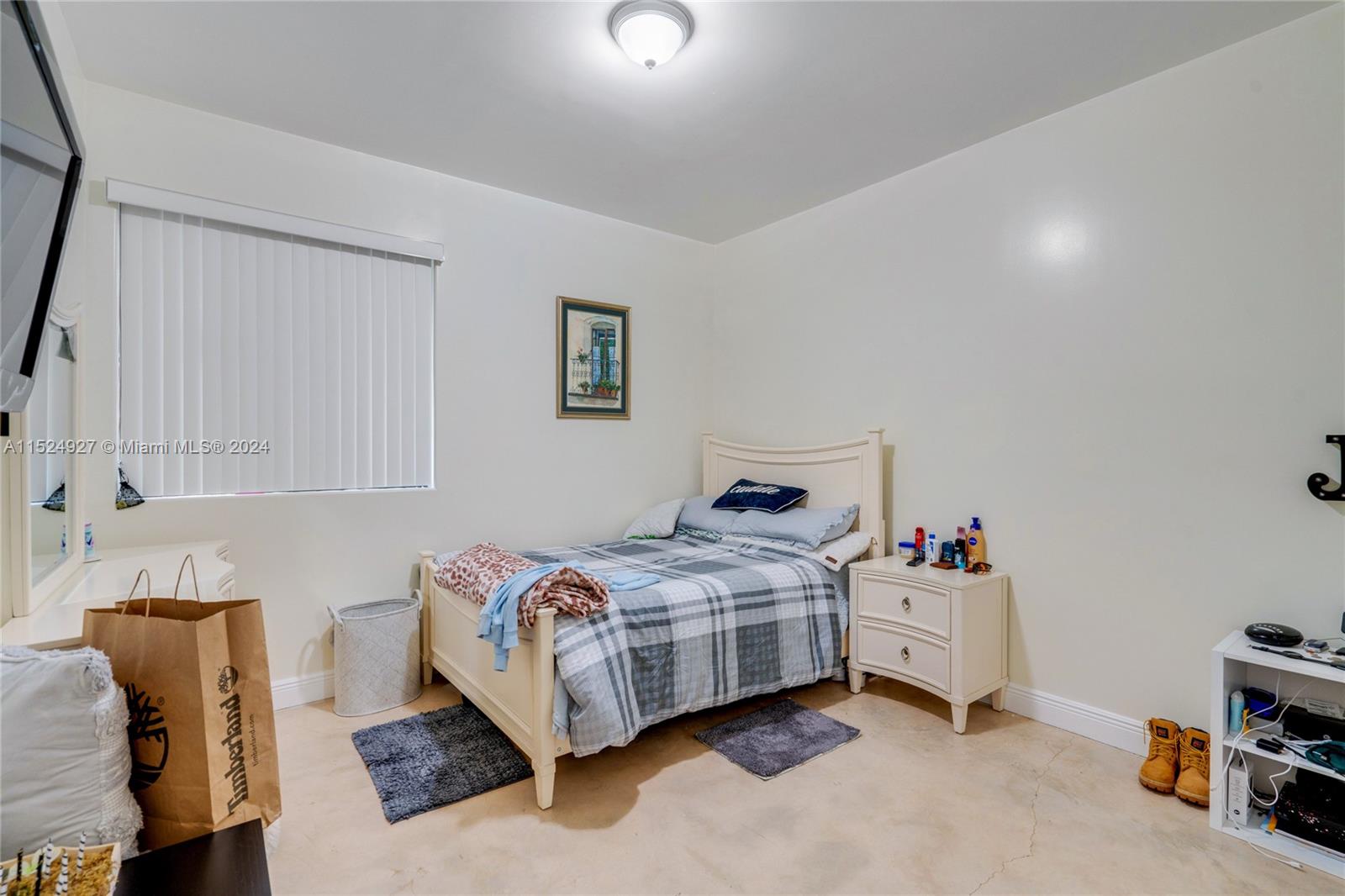 10129 West Jessamine Street Miami, FL 33157 - Photo 22 of 50 a bedroom with a bed and a couch