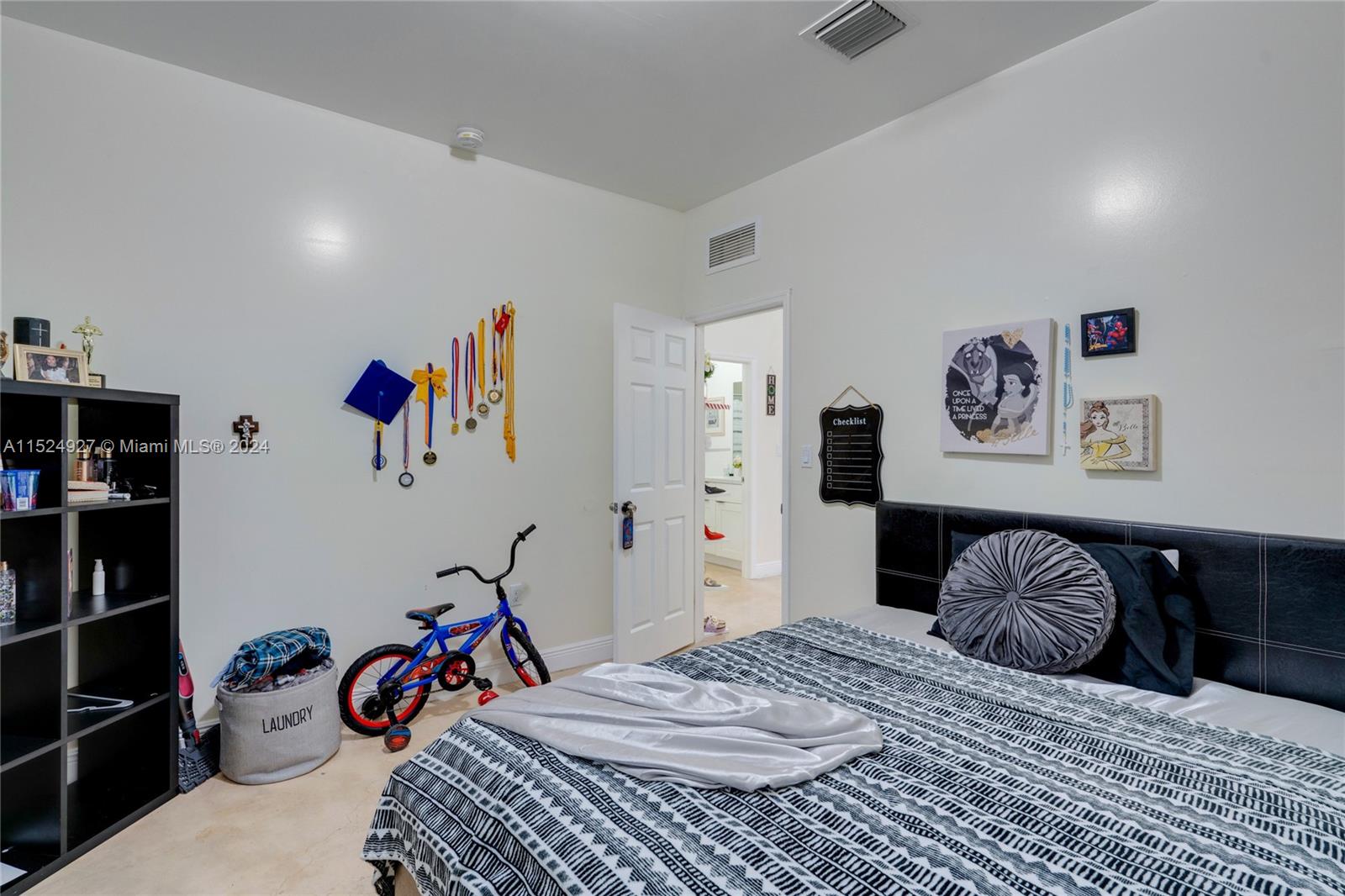 10129 West Jessamine Street Miami, FL 33157 - Photo 25 of 50 a bedroom with a bed and wooden floor