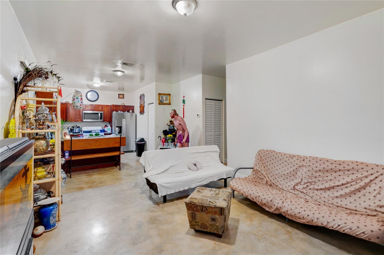 10129 West Jessamine Street Miami, FL 33157 - Photo 27 of 50 a living room with furniture and a baby crib