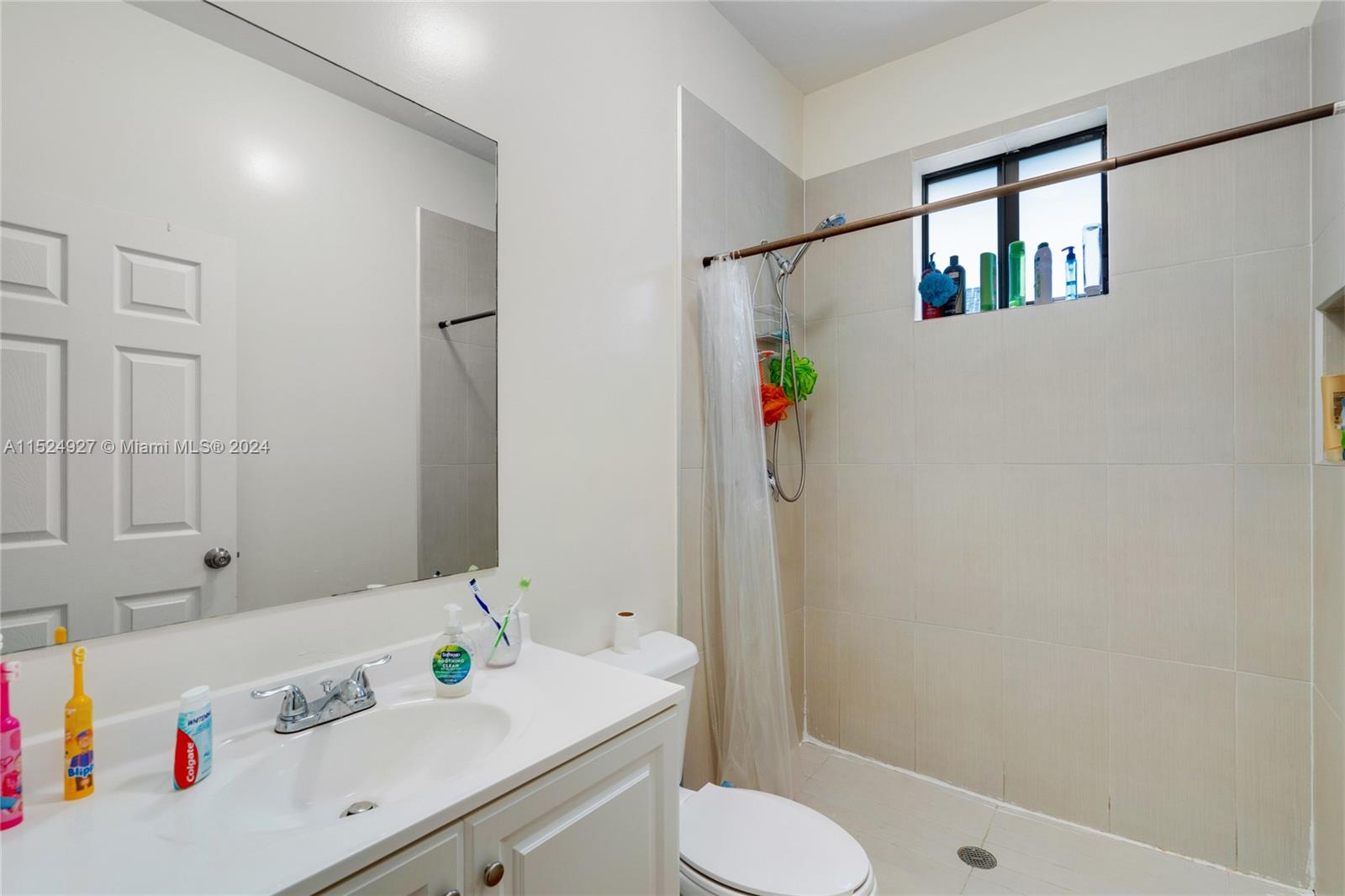 10129 West Jessamine Street Miami, FL 33157 - Photo 35 of 50 a bathroom with a sink a toilet and shower