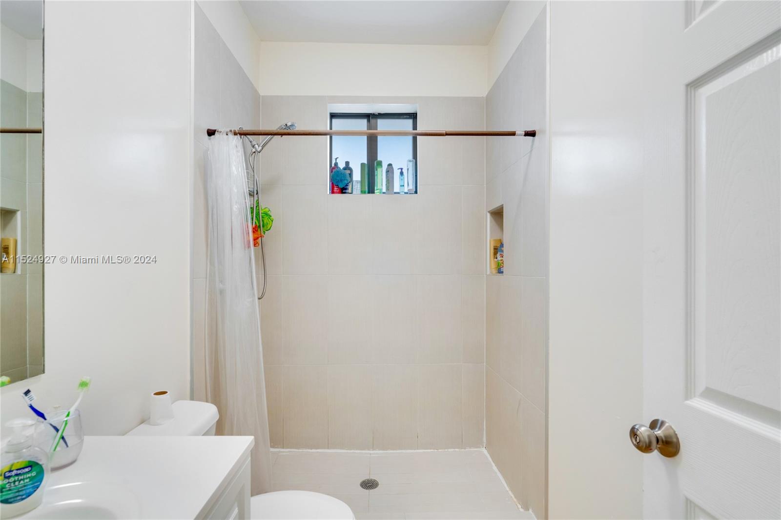10129 West Jessamine Street Miami, FL 33157 - Photo 36 of 50 a bathroom with a shower and a sink