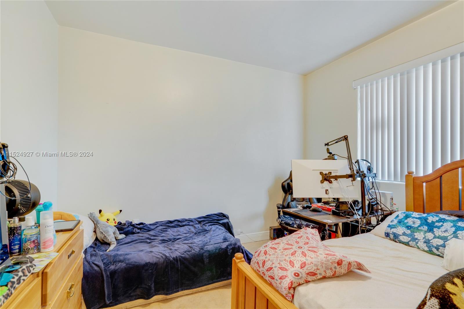 10129 West Jessamine Street Miami, FL 33157 - Photo 39 of 50 a bedroom with bed and a window