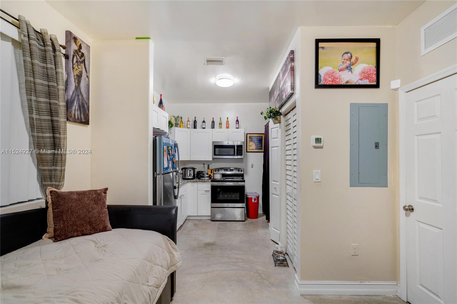10129 West Jessamine Street Miami, FL 33157 - Photo 43 of 50 a bed room with a bed and a walk in closet