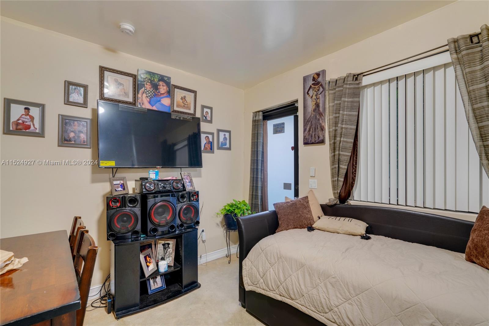 10129 West Jessamine Street Miami, FL 33157 - Photo 44 of 50 a bedroom with a bed and a flat screen tv