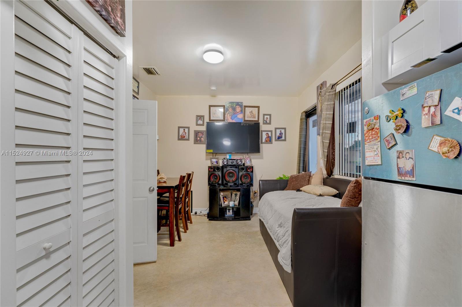 10129 West Jessamine Street Miami, FL 33157 - Photo 46 of 50 a living room with furniture and a flat screen tv