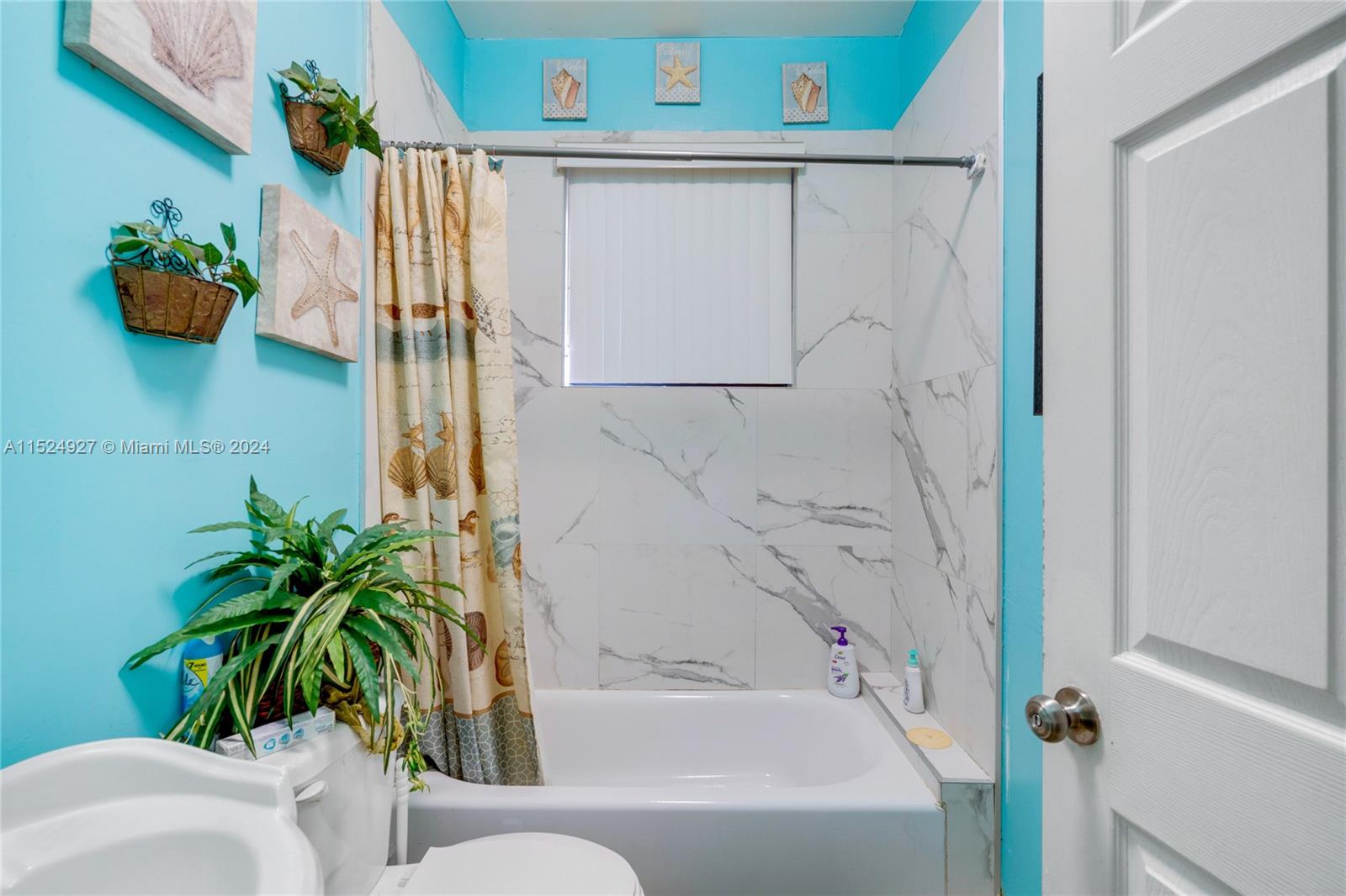10129 West Jessamine Street Miami, FL 33157 - Photo 48 of 50 a bathroom with a bathtub and shower
