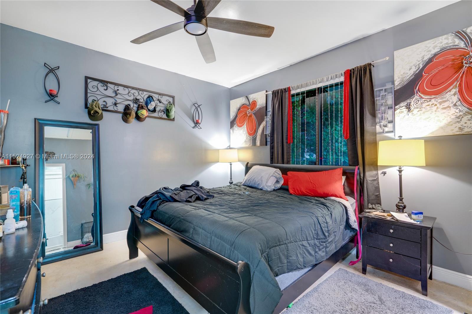 10129 West Jessamine Street Miami, FL 33157 - Photo 49 of 50 a bedroom with a bed and lamp