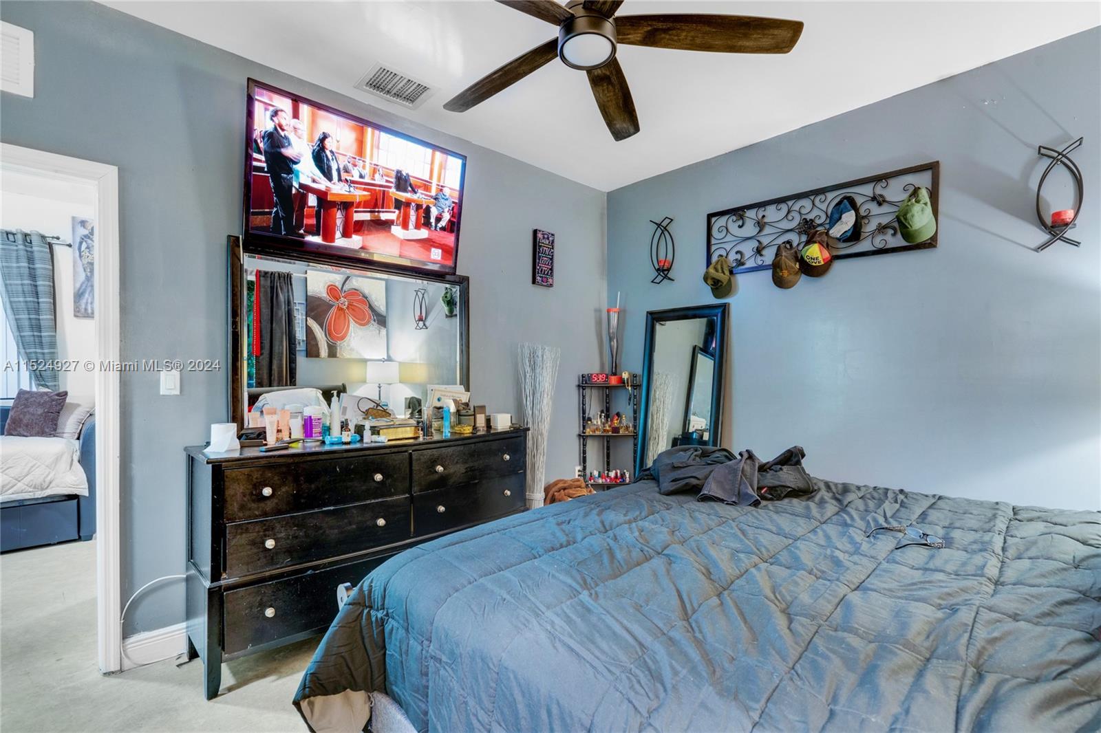 10129 West Jessamine Street Miami, FL 33157 - Photo 50 of 50 a bed room with a bed and a television