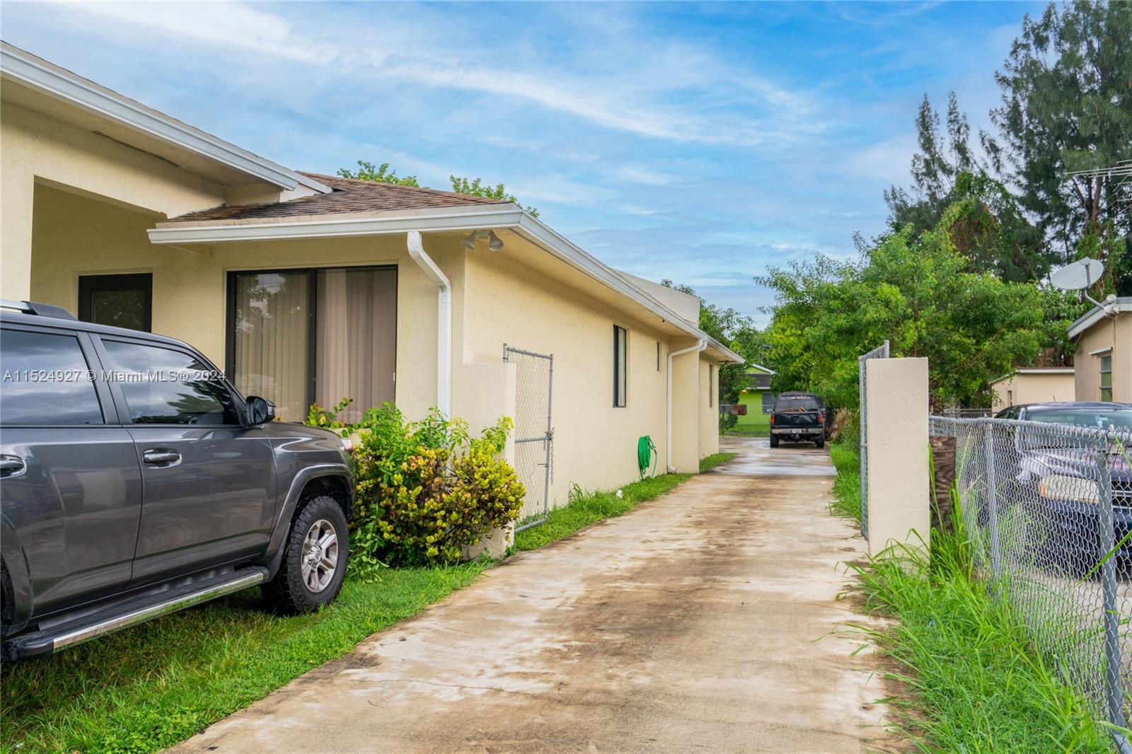 10129 West Jessamine Street Miami, FL 33157 - Photo 6 of 50 a front view of a house with a garden