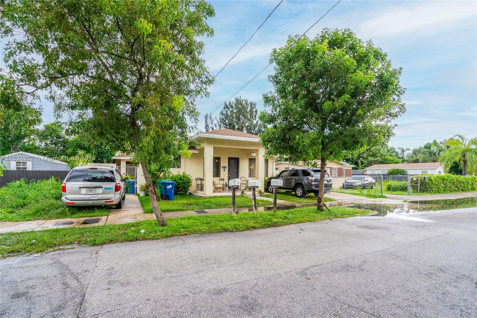 10129 West Jessamine Street Miami, FL 33157 - Photo 8 of 50 a front view of a house with garden and trees
