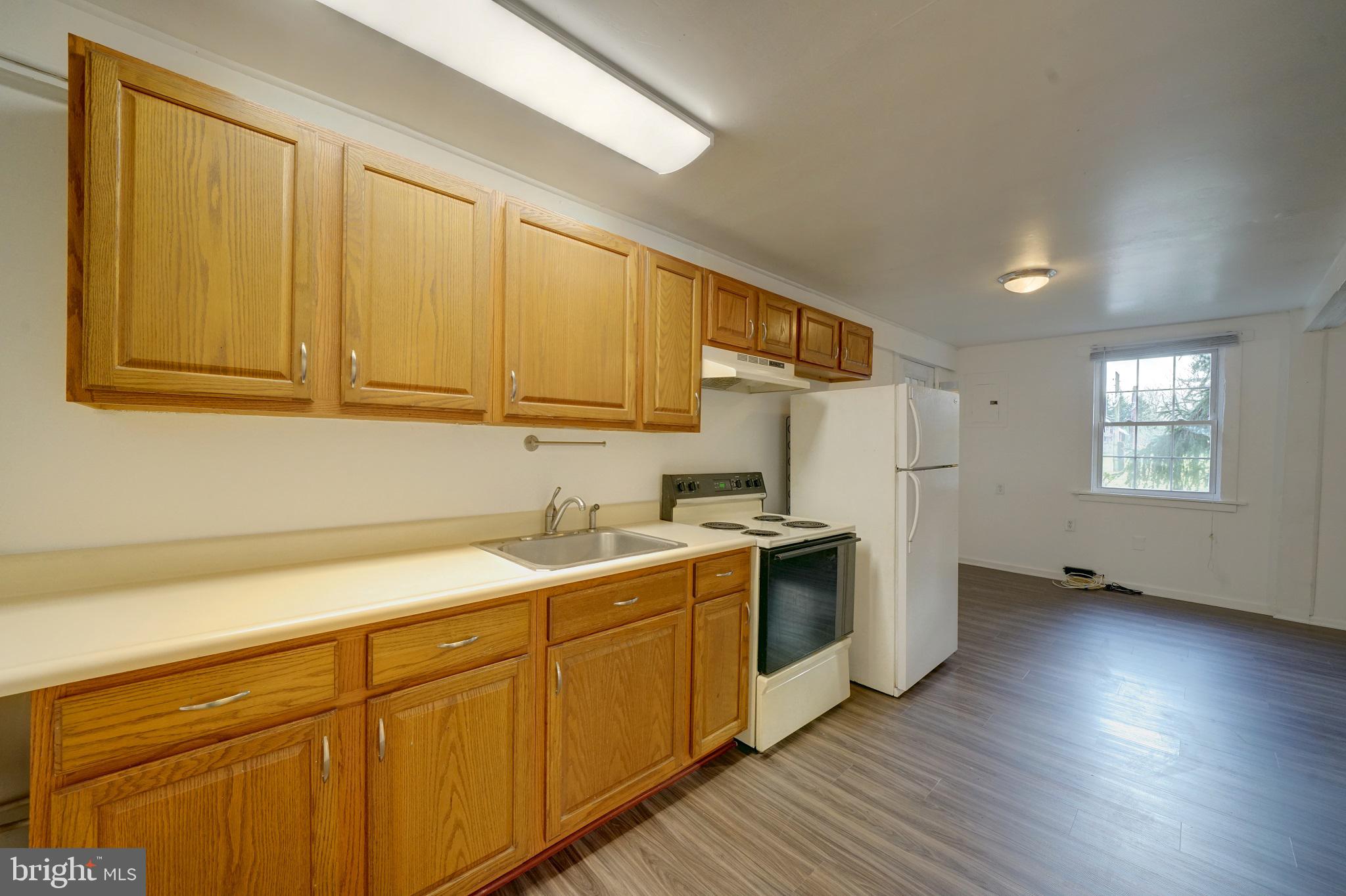 2793 Pfefferkorn Road, Unit D West Friendship, MD 21794 - Photo 11 of 26 a kitchen with a sink cabinets stainless steel appliances and a window