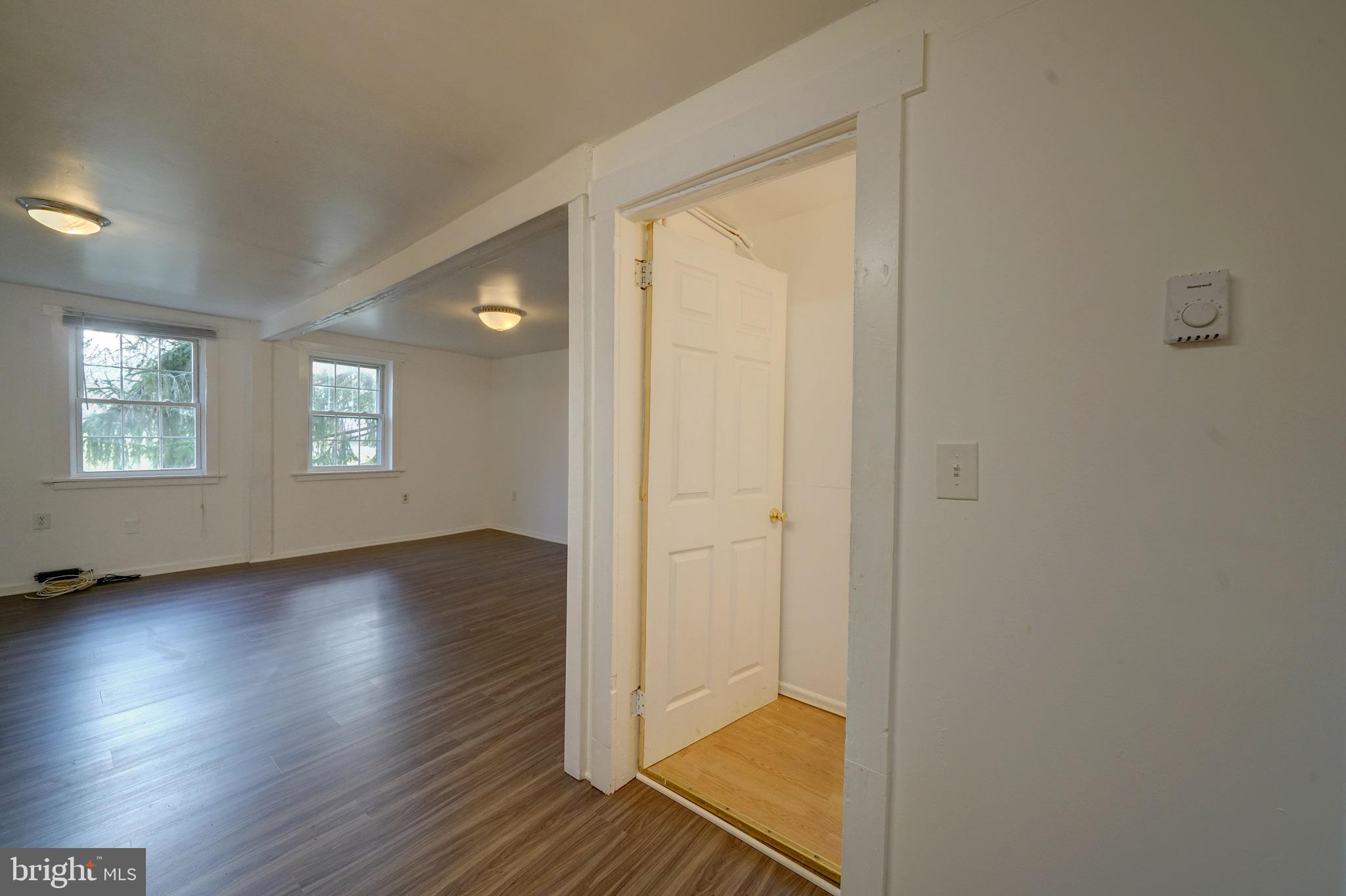 2793 Pfefferkorn Road, Unit D West Friendship, MD 21794 - Photo 12 of 24 an empty room with wooden floor and windows