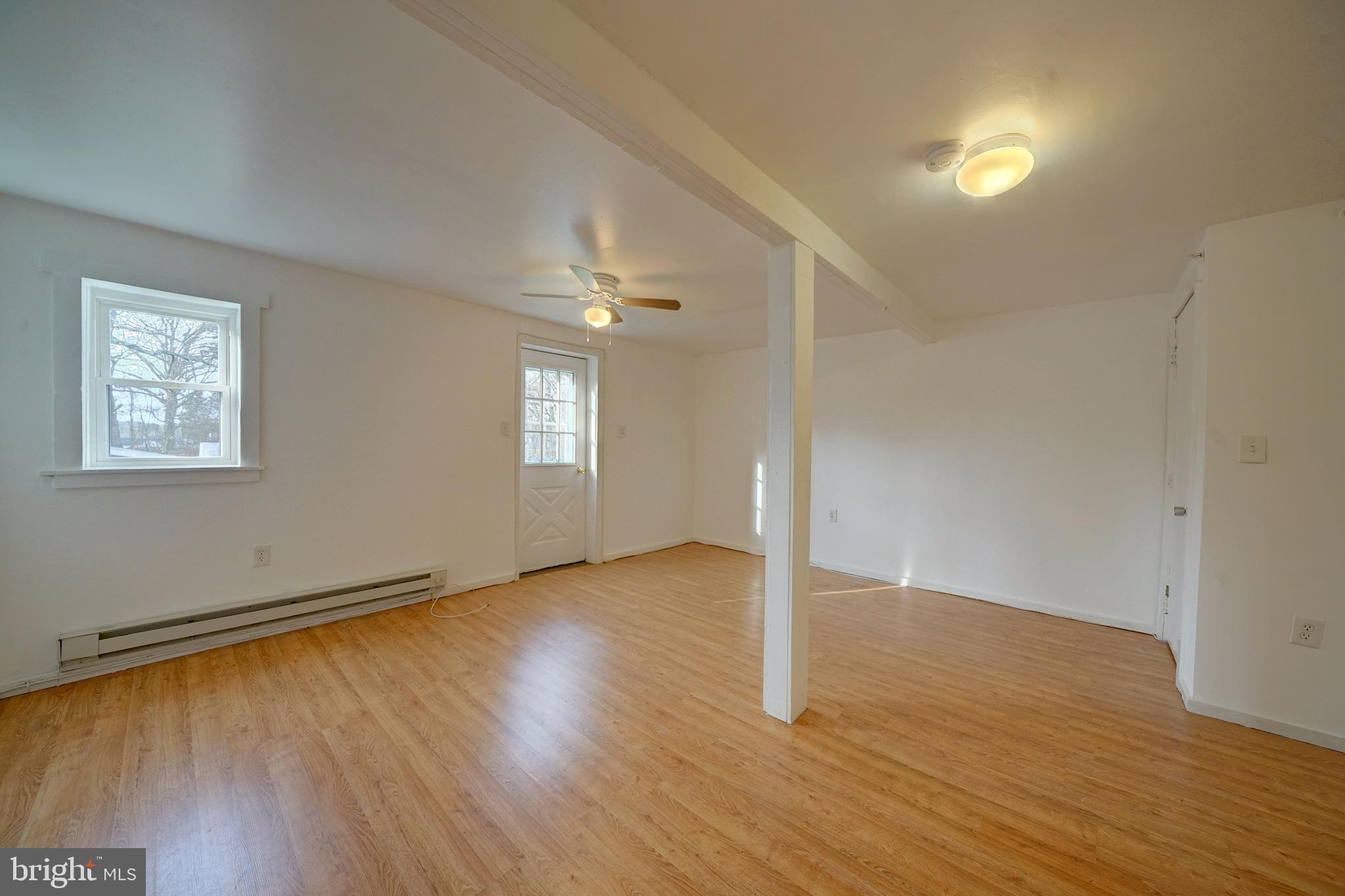 2793 Pfefferkorn Road, Unit D West Friendship, MD 21794 - Photo 14 of 24 an empty room with wooden floor and windows