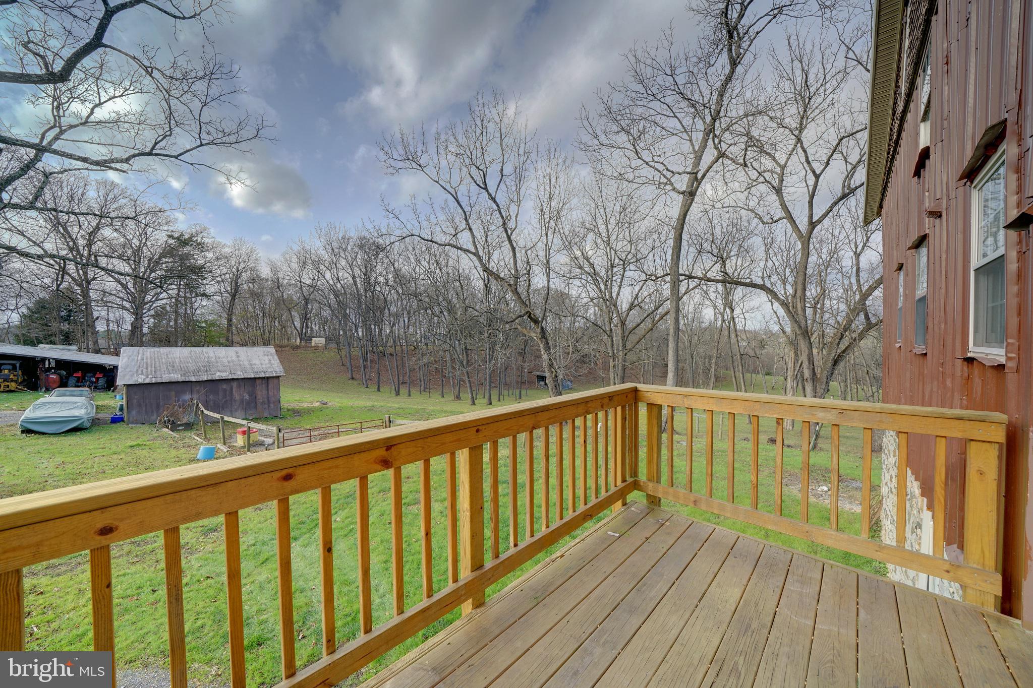 2793 Pfefferkorn Road, Unit D West Friendship, MD 21794 - Photo 3 of 26 a view of a wooden deck with trees