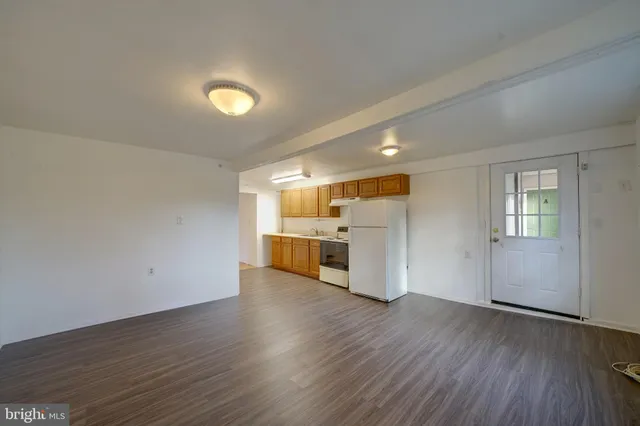 a view of a kitchen with a sink and a window