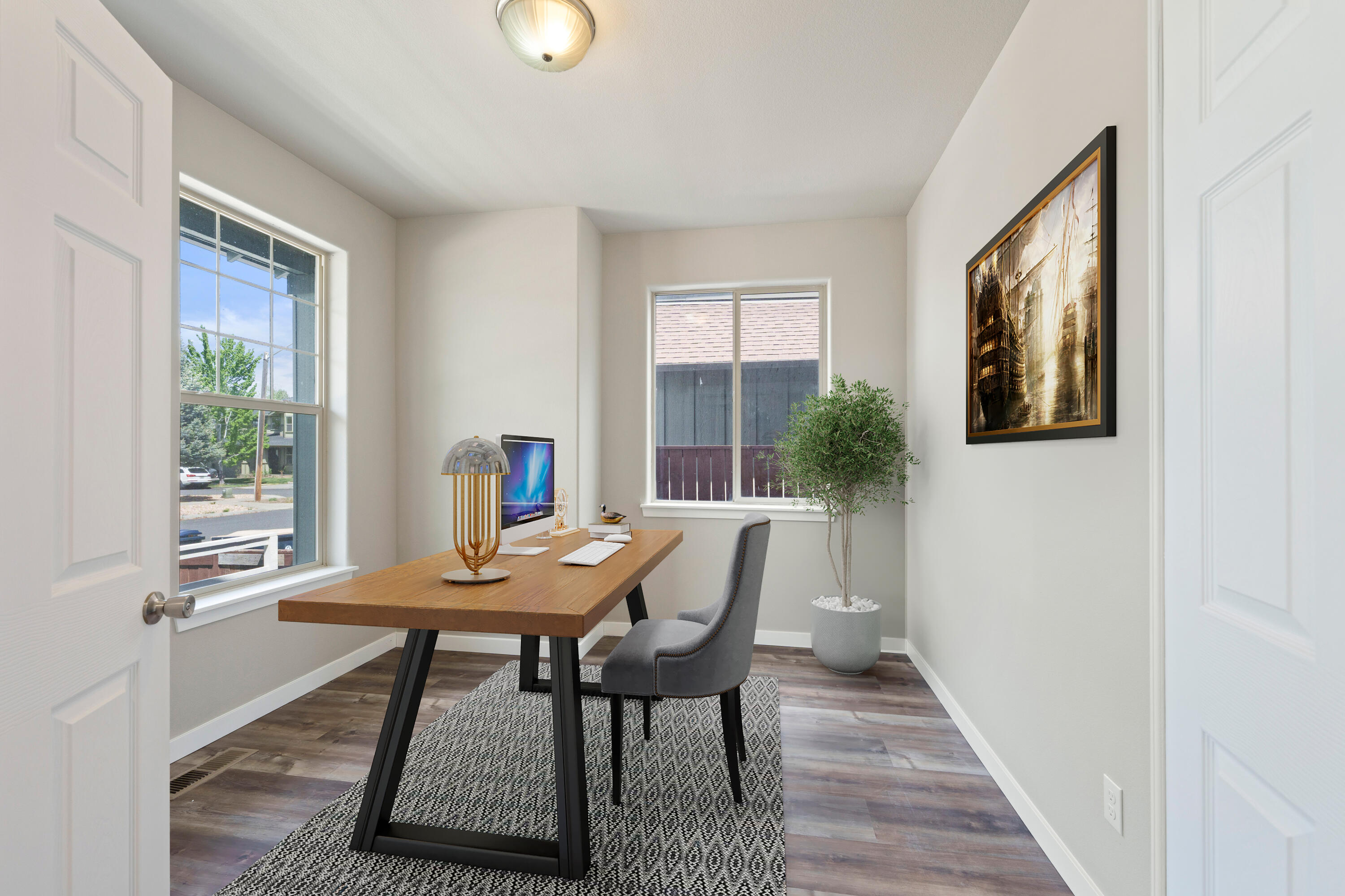 21189 Ritz Place Bend, OR 97702 - Photo 11 of 37 a view of a workspace with furniture and a window