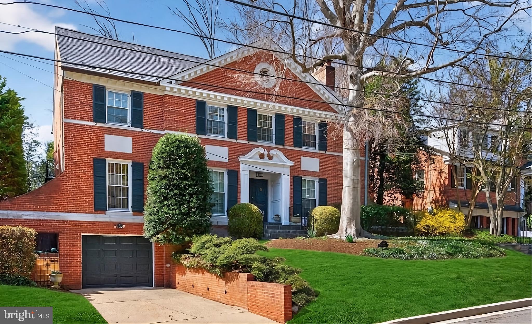 front view of a house with a garden
