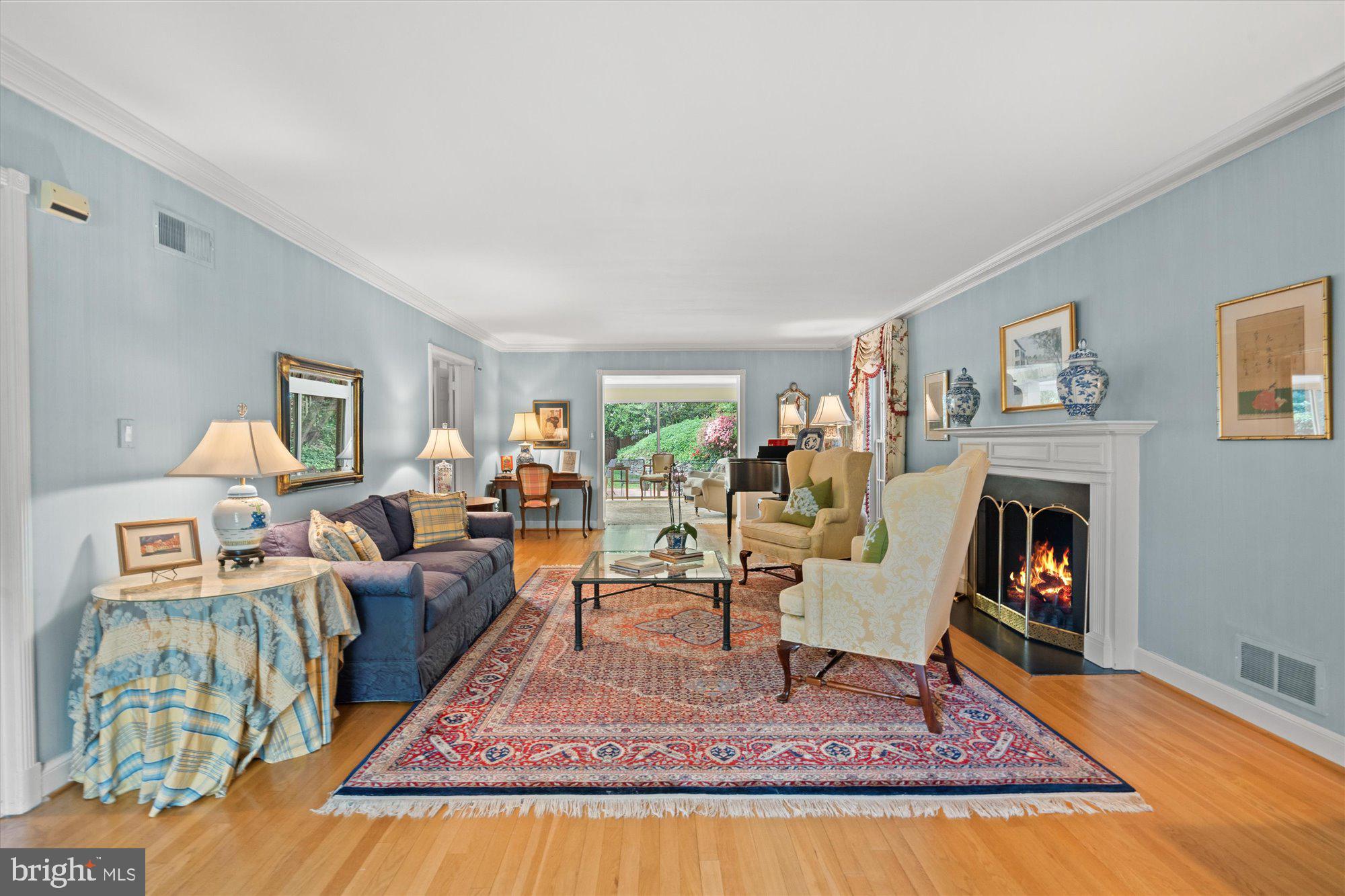 2238 47th Street Northwest Washington, DC 20007 - Photo 23 of 67 a living room with furniture and a fireplace