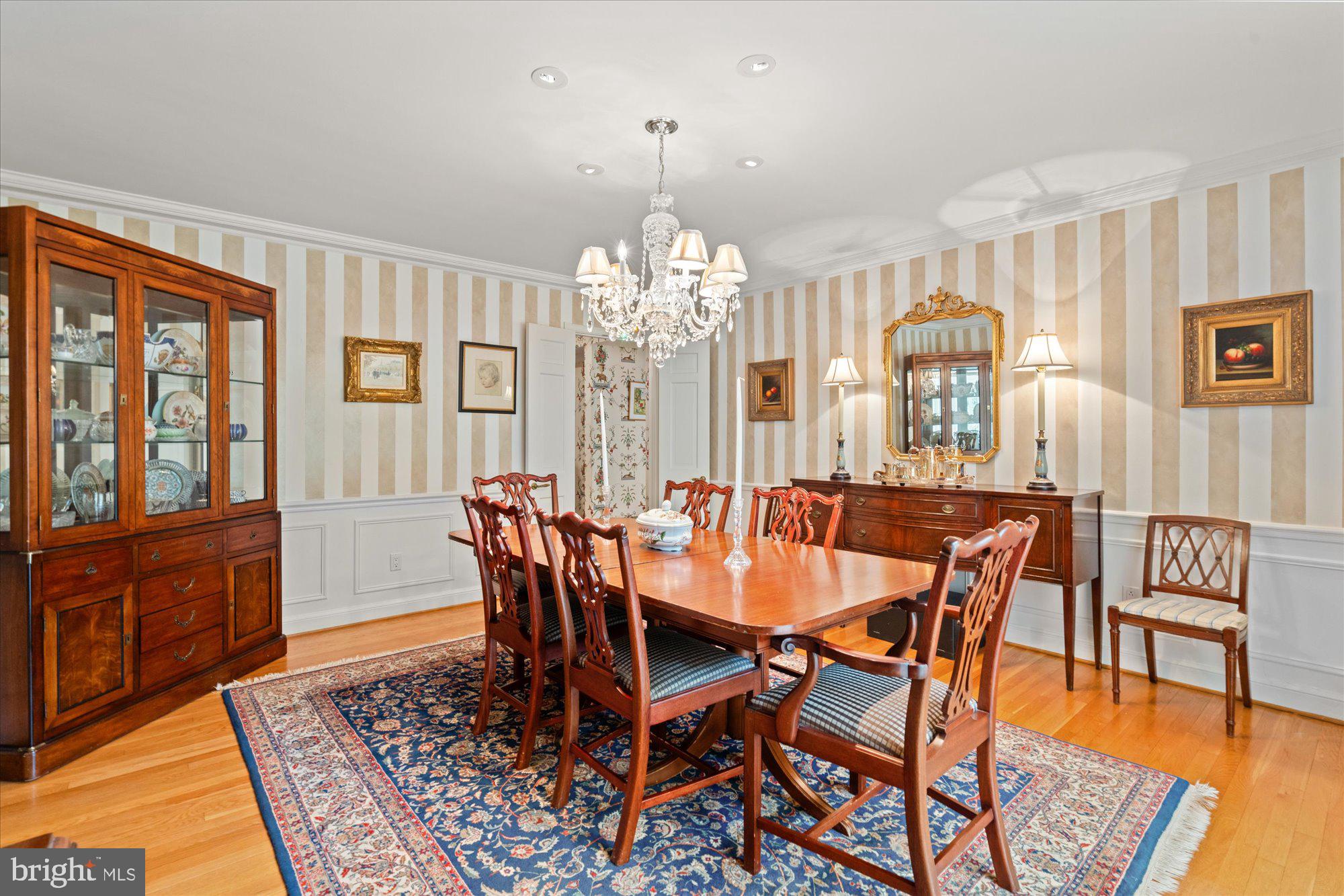 2238 47th Street Northwest Washington, DC 20007 - Photo 31 of 67 a view of a dining room with furniture a chandelier and wooden floor
